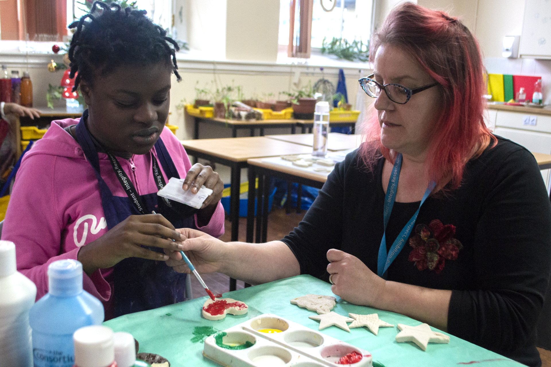 Tutor and Student using art and craft materials
